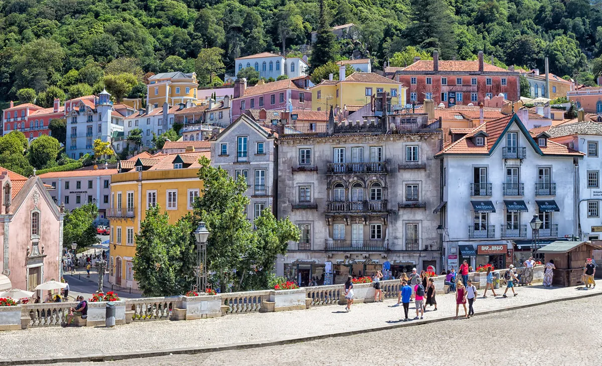Walkers exploring Sintra's colorful historic center in Portugal
